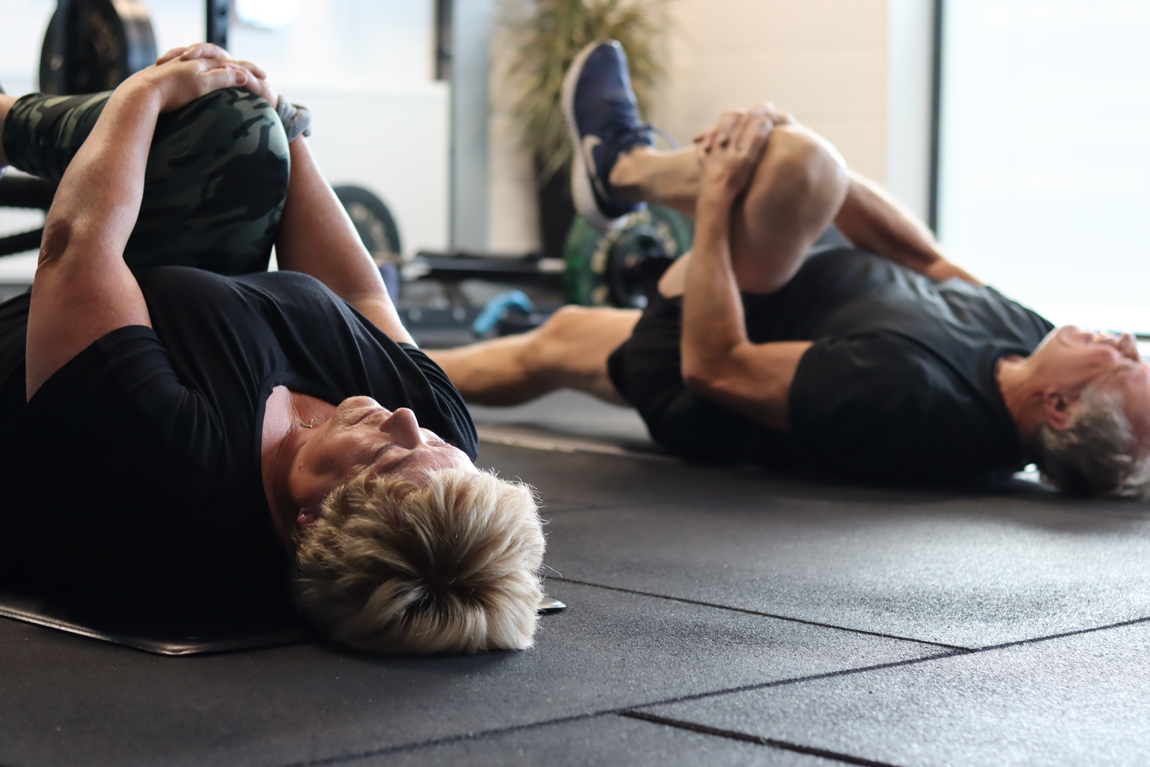Clients doing coached mobility work in the gym