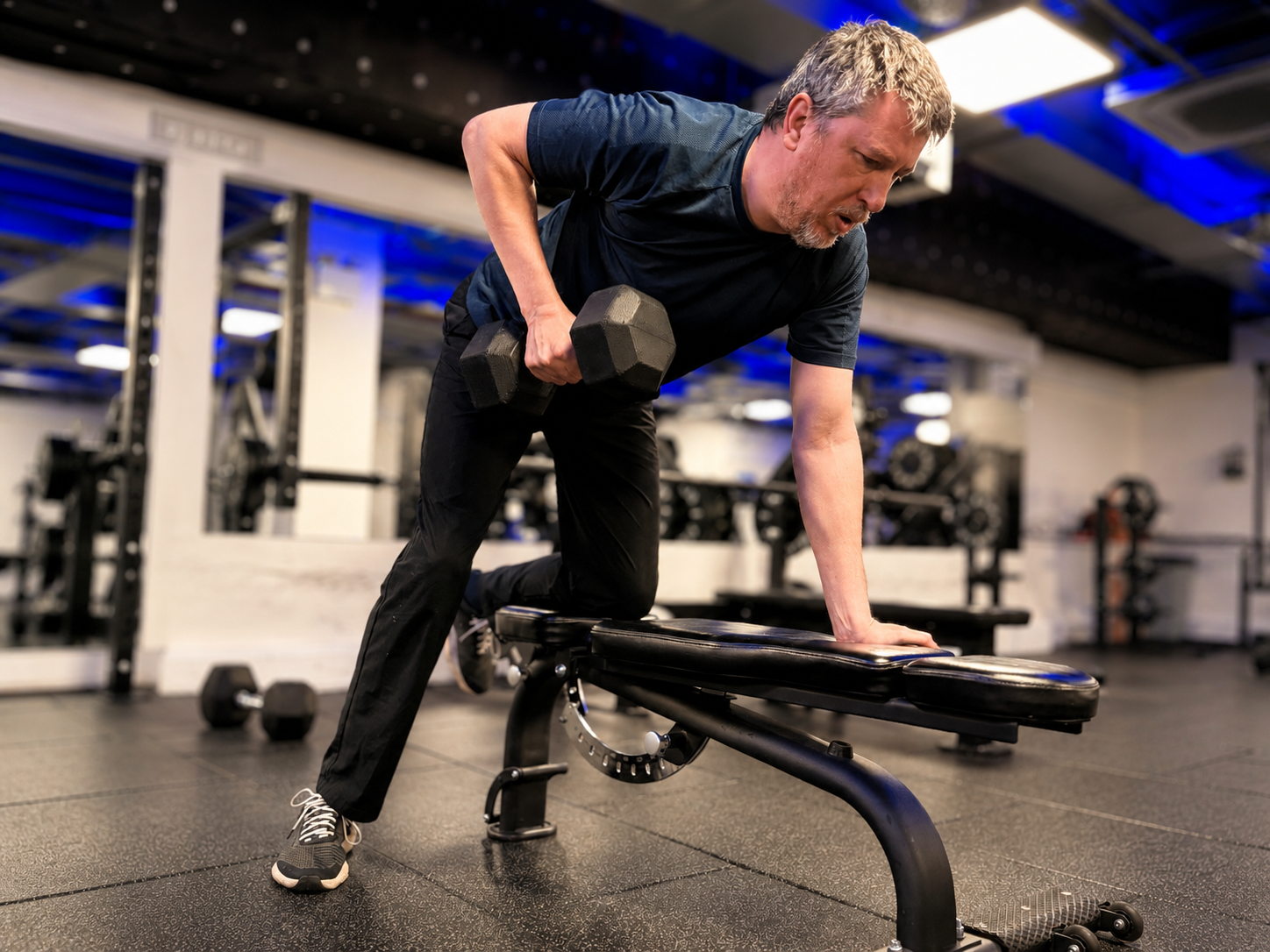 Steve training with Timmo during a dumbbell row session